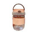 Pink tumbler placed beside laptop and notebook in modern office setting