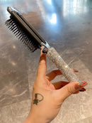Top-down shot highlighting mirror surface and cushioned comb base