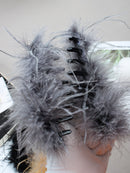 Clip worn with oversized glasses and minimalist earrings