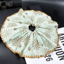 Aqua blue oversized fabric hair tie wrapped into a loose low ponytail on wavy hair