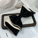 Side angle showing spring clamp mechanism and satin bow dimension