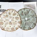 Front view of caramel and aqua blue boho fabric hair ties on neutral background