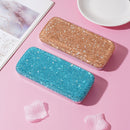 Side angle showing slim profile and precise crystal detailing of luxury glasses case