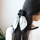 Close-up of fabric band elasticity test showing smooth stretch