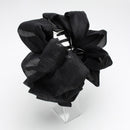 Top-down view highlighting multi-tiered bow structure and smooth clip finish