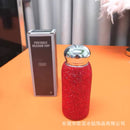 China red tumbler displayed upright with natural lighting and soft shadow