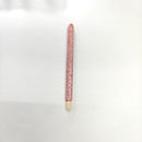 Turquoise and light green wooden brush handles placed beside makeup palette for creative context