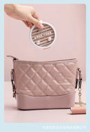 Minimalist desk setup featuring the jewelry box alongside stationery and a small plant