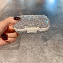 Overhead flat lay with vitamin bottles and organizer for wellness context