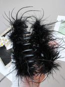 Clip held in hand to demonstrate lightweight, ergonomic size