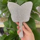 Detail of crystal edge work on lip-shaped mirror under soft studio lighting