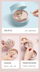 Macro view of velvet surface protecting a pair of gold stud earrings