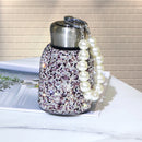 Nordic Pink variant on pastel gradient background, front-facing studio shot