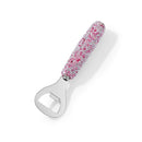 Lifestyle image of opener resting beside craft beer bottles on wooden bar