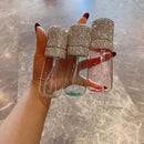 Side angle of white 60ml fine-mist spray bottle showing crystal detailing and ergonomic shape