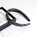 Black cashew print sponge headband front view studio shot