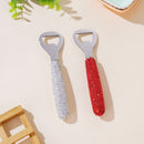 Close-up of diamond-accented surface detail on stainless steel opener